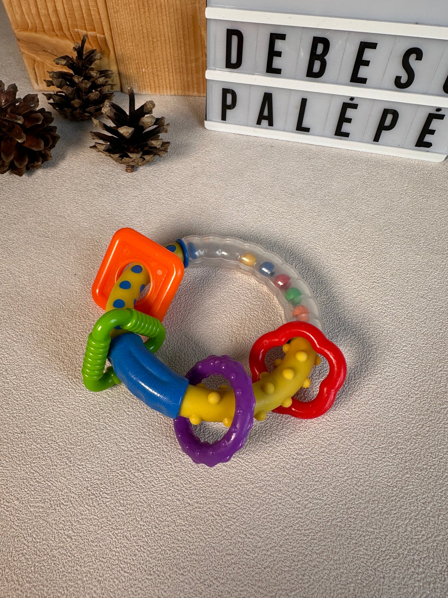 Barškučių rinkinys "Linksmas barškučių ratas 🎠🌈"